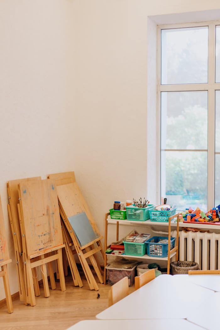 Cozy art room with kids easels, educational supplies, and natural light.